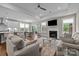 Bright and airy living space with open floor plan, fireplace, and seamless flow to the kitchen at 1548 Striped Bass Ln, Clover, SC 29710