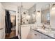 Bathroom featuring marble shower and sink with glass divider at 2246 Sharon Rd, Charlotte, NC 28207
