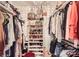 Walk-in closet with chandelier has lots of storage options at 2246 Sharon Rd, Charlotte, NC 28207