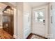 An inviting entryway leads to a closet and the front door, creating a warm and organized welcome at 2246 Sharon Rd, Charlotte, NC 28207