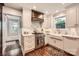 Bright kitchen featuring stainless steel appliances, marble backsplash, and modern fixtures at 2246 Sharon Rd, Charlotte, NC 28207