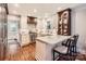 Bright kitchen features marble countertops, a breakfast bar, modern appliances, and stylish decor at 2246 Sharon Rd, Charlotte, NC 28207