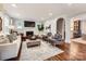 Bright living room with hardwood floors, fireplace, and stylish furniture at 2246 Sharon Rd, Charlotte, NC 28207