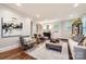 Inviting living room with stylish seating, elegant decor, and hardwood flooring at 2246 Sharon Rd, Charlotte, NC 28207