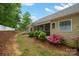 Well-maintained backyard features flower beds, mulch, and a screened-in porch, enhancing outdoor living at 2646 N Olivers Cross Rd, Newton, NC 28658