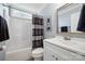 Neutral bathroom with a shower/tub, toilet, and vanity with a mirrored wall cabinet at 2646 N Olivers Cross Rd, Newton, NC 28658