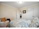 Bright bedroom with neutral decor, wooden floors and natural light from a large window at 2646 N Olivers Cross Rd, Newton, NC 28658
