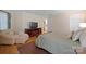Cozy bedroom featuring hardwood floors, a comfortable chair and a television at 2646 N Olivers Cross Rd, Newton, NC 28658