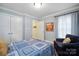 Inviting bedroom with hardwood floors, comfortable armchair, and natural light at 2646 N Olivers Cross Rd, Newton, NC 28658