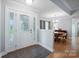 Bright foyer featuring tile flooring, decorative glass door, and an elegant dining area at 2646 N Olivers Cross Rd, Newton, NC 28658