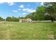 Expansive front lawn with mature trees, offering a serene and inviting approach to the property at 2646 N Olivers Cross Rd, Newton, NC 28658