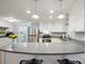 Bright kitchen boasting white cabinets, stainless steel appliances, and an open layout with a breakfast bar at 2646 N Olivers Cross Rd, Newton, NC 28658