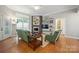 Living area features a fireplace, hardwood floors, and light grey paint at 2646 N Olivers Cross Rd, Newton, NC 28658