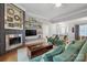 Inviting living room with a modern fireplace, floating shelves, and comfortable seating area at 2646 N Olivers Cross Rd, Newton, NC 28658