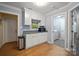 Mud room with added storage, hardwood floors and grey paint at 2646 N Olivers Cross Rd, Newton, NC 28658