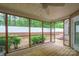 Relaxing screened porch overlooking a private backyard with lush greenery and a peaceful ambiance at 2646 N Olivers Cross Rd, Newton, NC 28658