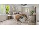 Inviting primary bedroom with plush bedding, soothing colors, stylish accents, and natural light from two windows at 2701 Wimbledon Dr, Gastonia, NC 28056