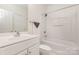 Elegant bathroom featuring modern fixtures, tub-shower, and white vanity at 3158 Walnut Park Dr, Charlotte, NC 28262
