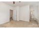 Bright bedroom with neutral carpet, ceiling fan and three doors at 3158 Walnut Park Dr, Charlotte, NC 28262
