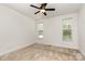 A cozy bedroom with carpet floors, a ceiling fan, and two windows for ample light at 3158 Walnut Park Dr, Charlotte, NC 28262