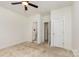Spacious bedroom offers ample natural light, ceiling fan, and access to the bathroom at 3158 Walnut Park Dr, Charlotte, NC 28262