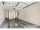 Spacious garage with concrete floor and overhead door, ready for vehicles or storage at 3158 Walnut Park Dr, Charlotte, NC 28262