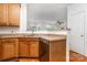 The bright kitchen features a stainless steel dishwasher and wood cabinets at 3158 Walnut Park Dr, Charlotte, NC 28262