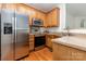 This kitchen has stainless steel appliances and wood cabinets at 3158 Walnut Park Dr, Charlotte, NC 28262
