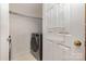 Practical laundry area with modern machines and convenient shelving at 3158 Walnut Park Dr, Charlotte, NC 28262