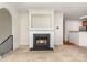 Inviting living room featuring neutral carpet, a fireplace and views into the kitchen at 3158 Walnut Park Dr, Charlotte, NC 28262