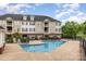 Community pool offers residents a refreshing escape with ample seating and well-maintained grounds at 3158 Walnut Park Dr, Charlotte, NC 28262