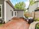 Cozy backyard patio with brick pavers, an outdoor seating area, and a charming backyard at 335 Greystone Rd, Charlotte, NC 28209