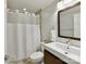 Bathroom featuring a shower with a curtain, a sink with a towel, and a toilet at 335 Greystone Rd, Charlotte, NC 28209