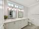 Elegant bathroom with double vanity, framed mirrors, and ample storage at 335 Greystone Rd, Charlotte, NC 28209