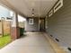 Spacious carport with brick and wood pillars, providing ample covered parking and protection from the elements at 335 Greystone Rd, Charlotte, NC 28209