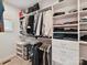 Organized walk-in closet features custom shelving and plenty of hanging storage space at 335 Greystone Rd, Charlotte, NC 28209