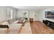 Inviting living room boasts hardwood floors, neutral decor, and a comfortable sectional sofa at 335 Greystone Rd, Charlotte, NC 28209