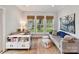 Stylish home office with natural light, a comfortable sofa, and views of the outdoors at 335 Greystone Rd, Charlotte, NC 28209