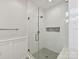 Sleek shower with glass door, white subway tile, and a built-in niche at 335 Greystone Rd, Charlotte, NC 28209