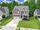 Beautiful home features a well-manicured lawn, inviting curb appeal, and a spacious driveway at 4016 Garden Oak Dr, Indian Trail, NC 28079