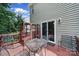 Backyard deck with table and chairs and glass sliding door at 4016 Garden Oak Dr, Indian Trail, NC 28079