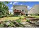 View of a lovely backyard featuring a deck, patio, landscaping, and garden at 4016 Garden Oak Dr, Indian Trail, NC 28079