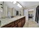 Bathroom featuring a double vanity with a granite countertop and tile flooring and views to the bedroom at 4016 Garden Oak Dr, Indian Trail, NC 28079