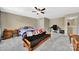 Bedroom featuring carpet, ceiling fan, a bed, and functional furniture for study and sleep at 4016 Garden Oak Dr, Indian Trail, NC 28079