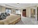 Bedroom showcasing carpet, a TV, neutral walls, decorative curtains, and a window with natural light at 4016 Garden Oak Dr, Indian Trail, NC 28079