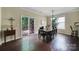 Dining area with hardwood floors and sliding glass doors leading to an outdoor deck at 4016 Garden Oak Dr, Indian Trail, NC 28079