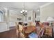 Dining room featuring wood floors, a chandelier, and traditional decor at 4016 Garden Oak Dr, Indian Trail, NC 28079