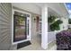 Inviting front entry featuring a decorative wreath, covered porch, and charming architectural details at 4016 Garden Oak Dr, Indian Trail, NC 28079