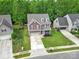 A spacious two-story house, well-manicured lawn, and two-car garage offer comfort and curb appeal at 4016 Garden Oak Dr, Indian Trail, NC 28079