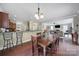 Kitchen, dining, and living room open concept with stainless steel appliances and hardwood floors at 4016 Garden Oak Dr, Indian Trail, NC 28079